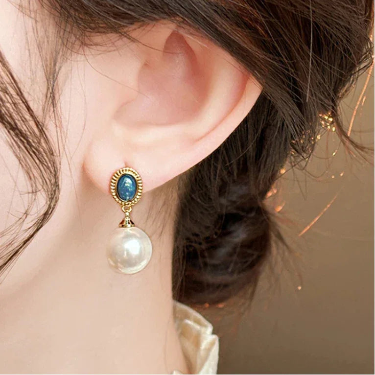 Blue Opal and Pearl Drop Earrings — right-ear worn close-up showing scale