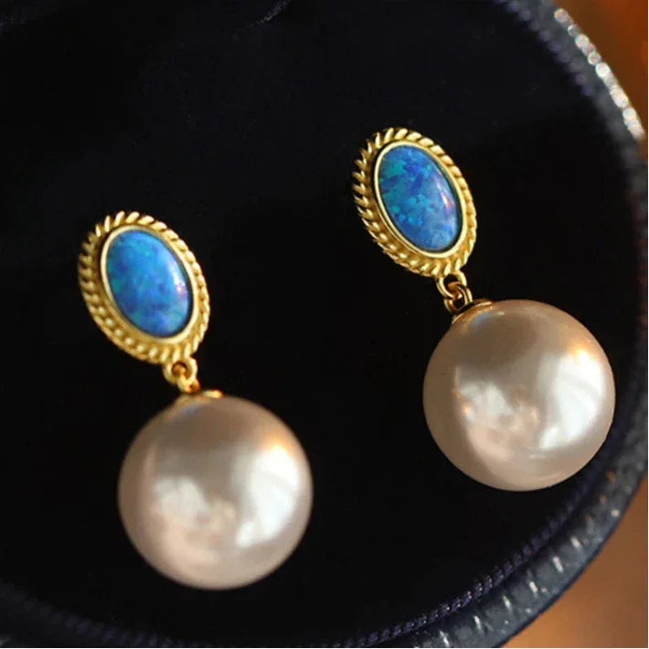 Blue Opal and Pearl Drop Earrings — pair displayed inside a dark jewelry case
