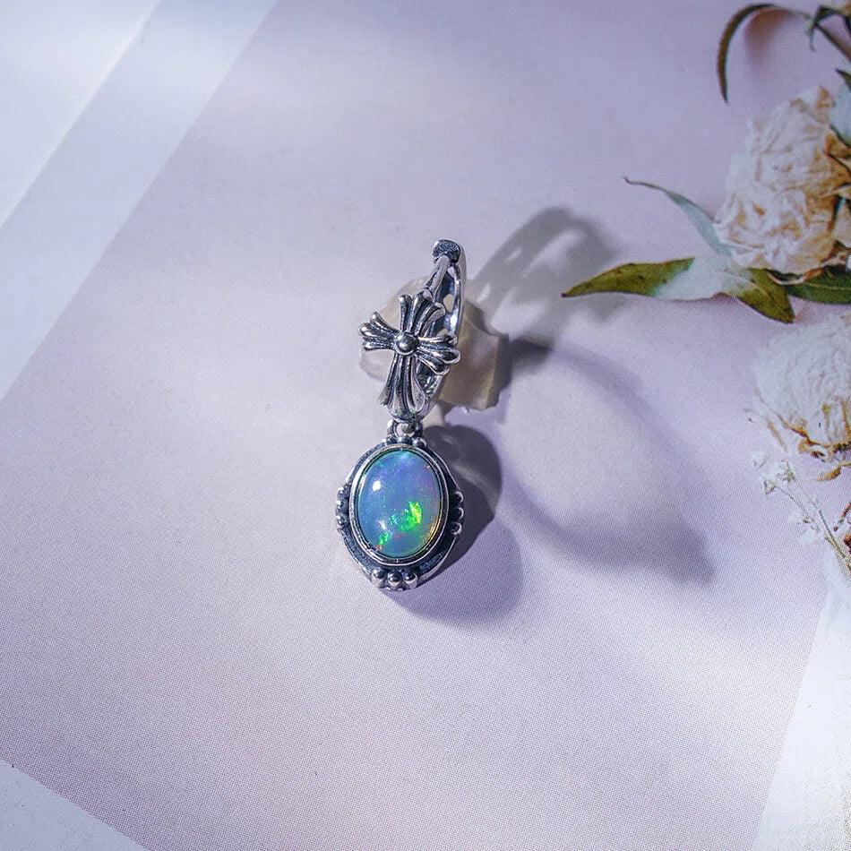Opal Floral Drop Earrings worn on the hand