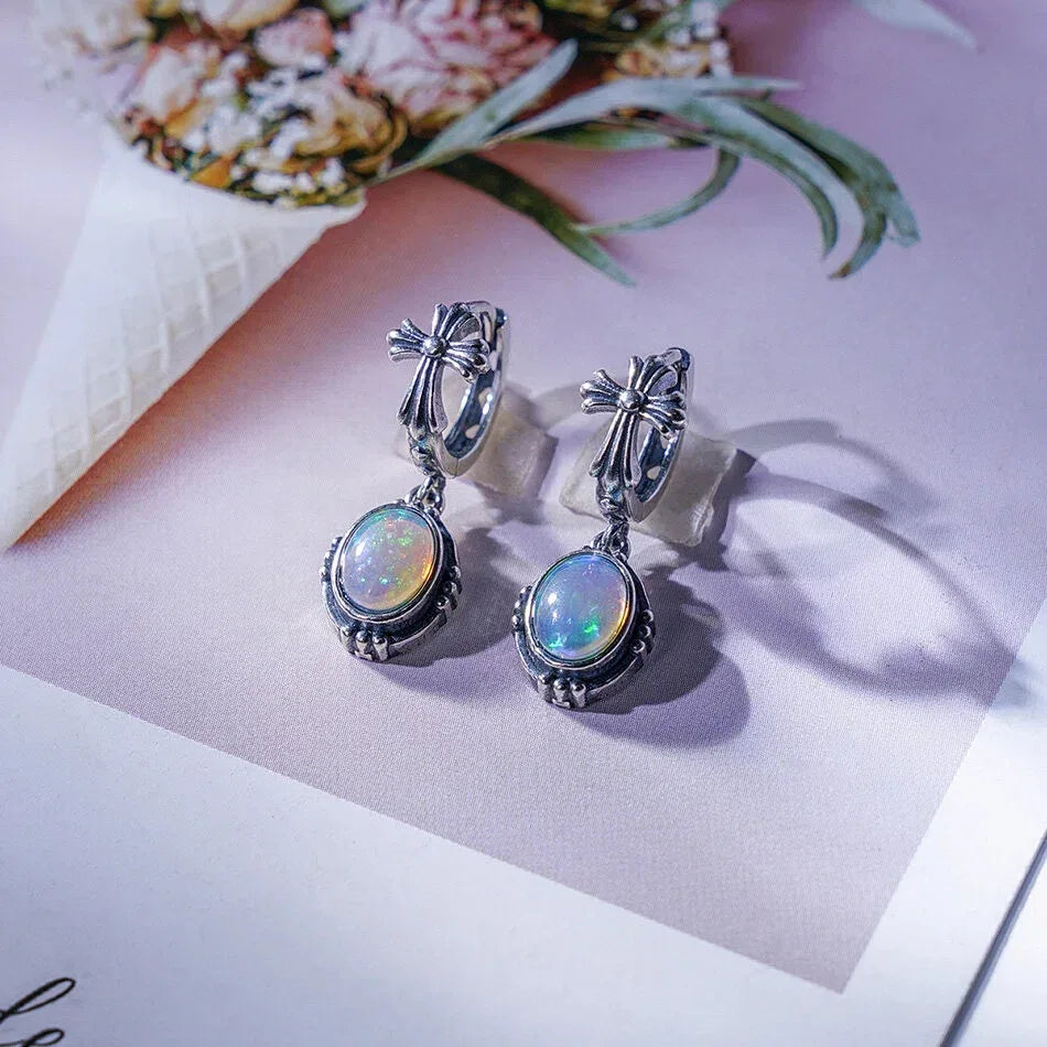 Opal Floral Drop Earrings worn on the hand from another angle