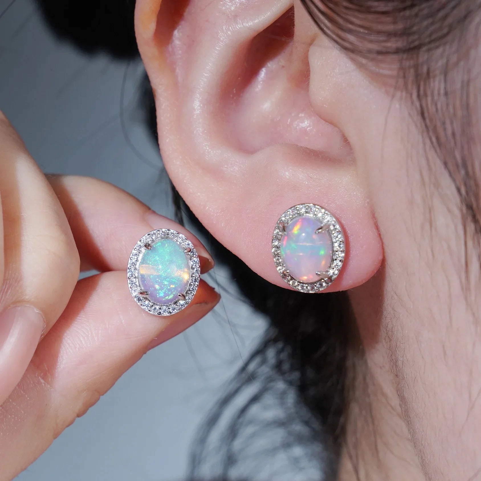 Opal Round Halo Stud Earrings angled product view