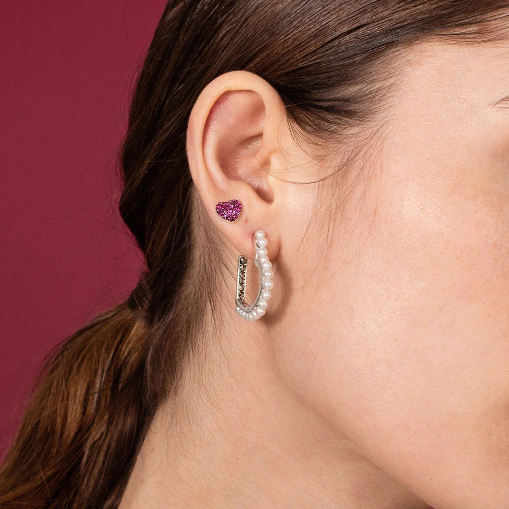 Pearl-Lined Open Heart Earrings — left-ear worn close-up showing the open-heart scale