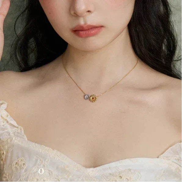 Orange Garnet Two-Tone Floral Necklace worn at the neckline in a close-up