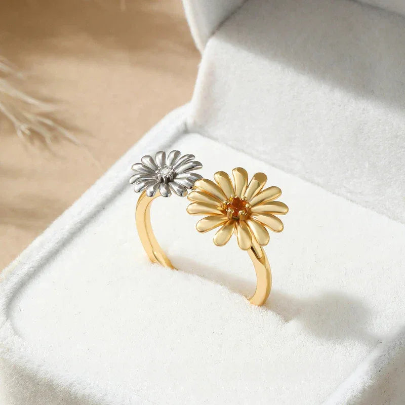 Orange Garnet Two-Tone Floral Open Ring side view held between the fingers