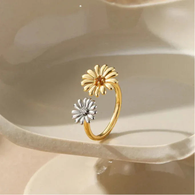 Orange Garnet Two-Tone Floral Open Ring worn on the hand in a close-up