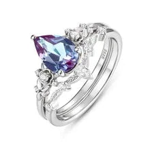 Oval Alexandrite cluster ring with a curved matching band, alternate front product view on a white background