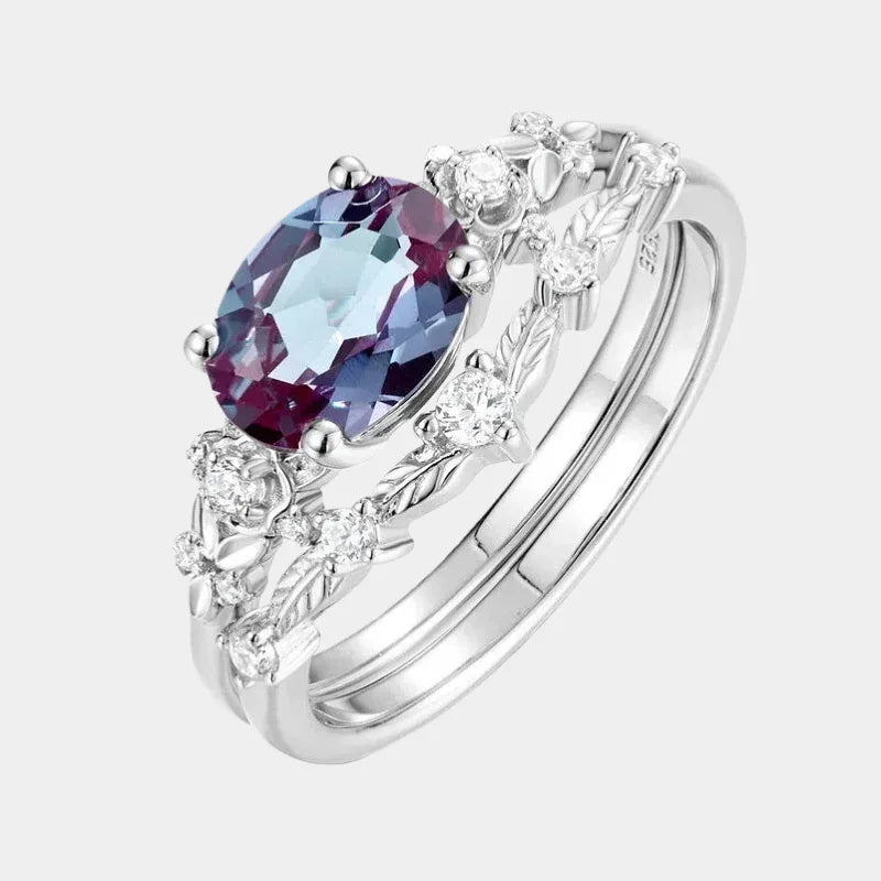 Oval Alexandrite floral three-band ring with clear accents, front product view on a white background