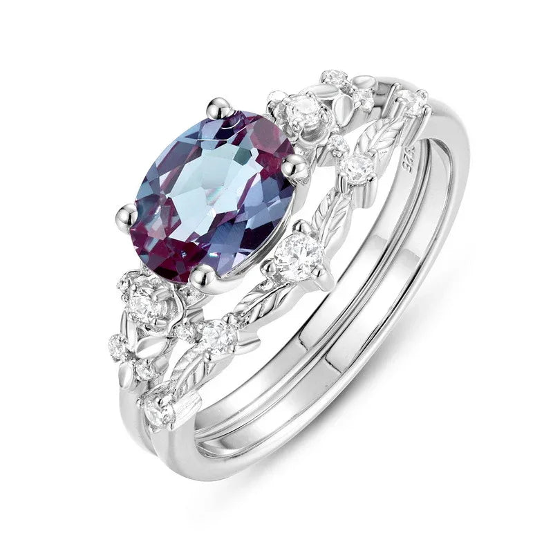 Oval Alexandrite floral three-band ring with clear accents, alternate front product view on a white background