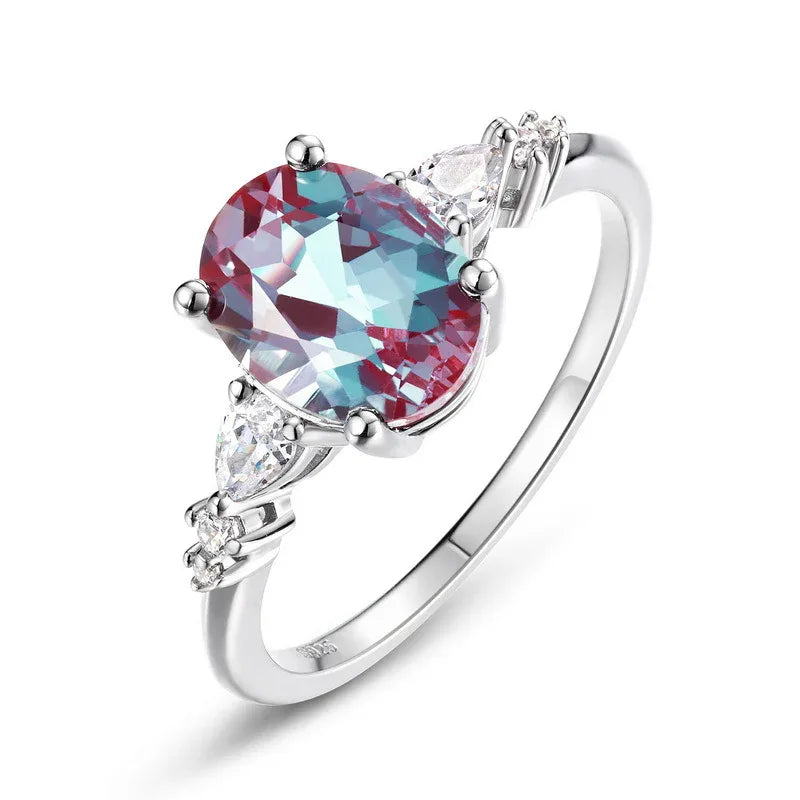 Oval Alexandrite leaf bypass ring with clear accents, alternate front product view on a white background