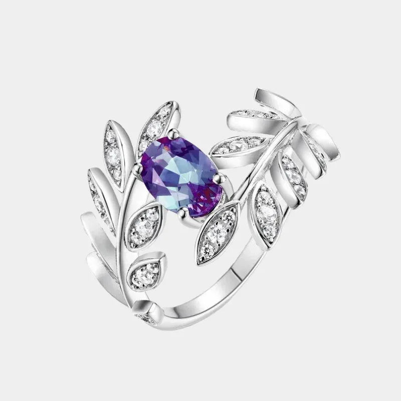Oval Alexandrite leaf wrap ring with clear accents, front product view on a white background