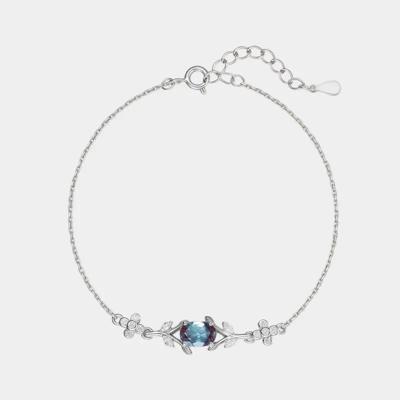 Oval Alexandrite station bracelet with clear accents, full product view on a white background