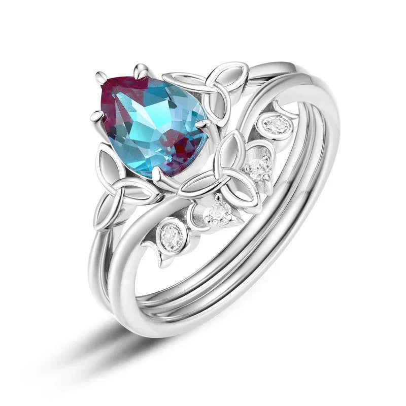 Oval Alexandrite three-band ring with leaf and clear-stone accents, alternate front product view