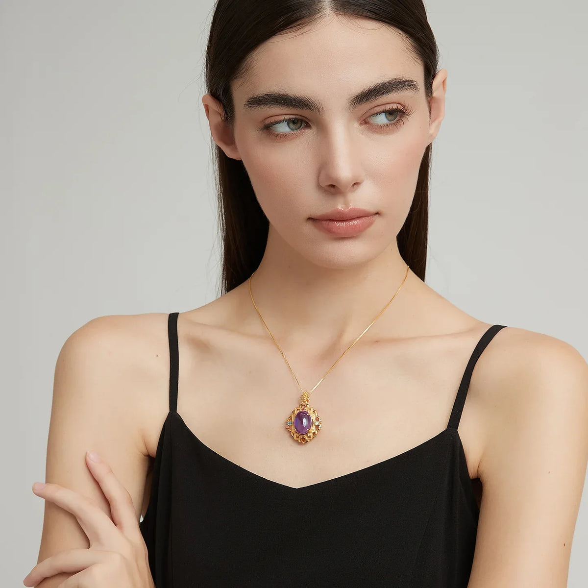 oval amethyst filigree pendant necklace second neckline view in soft light