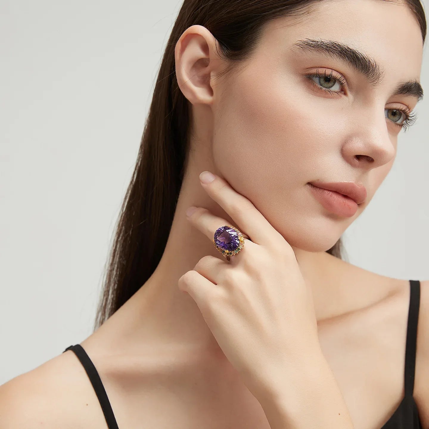 oval amethyst multigem ring styled portrait showing the ring for scale