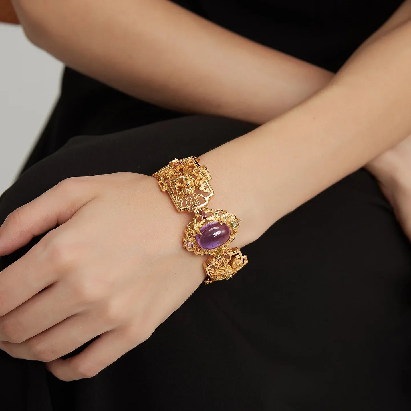 oval amethyst openwork bracelet worn on the wrist from a second angle