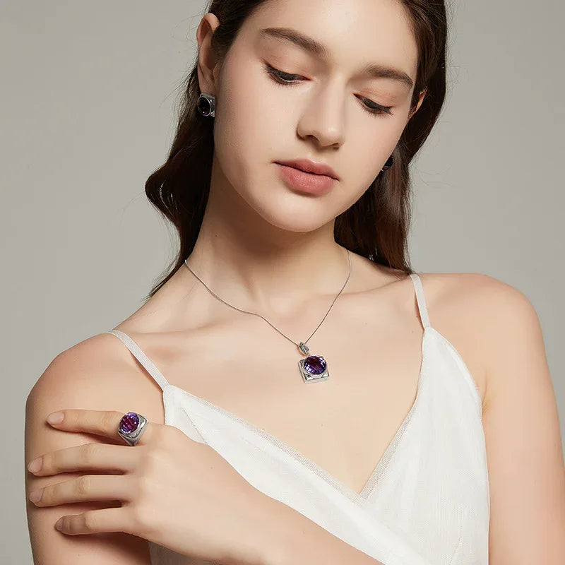 oval amethyst sculptural ring styled portrait showing the ring for scale