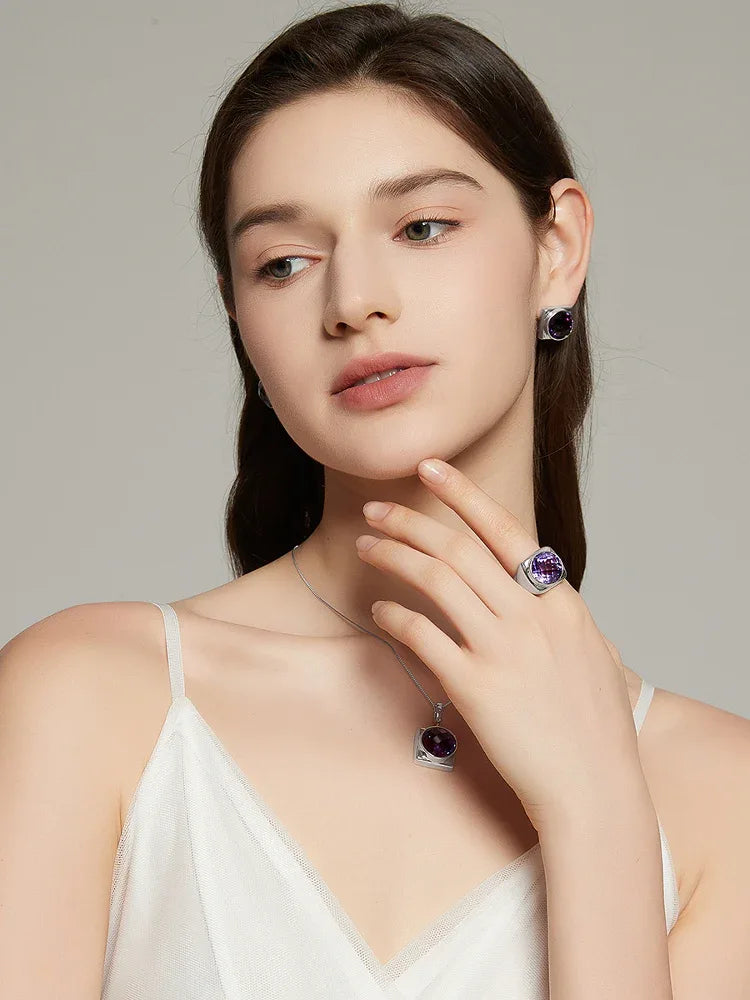 oval amethyst sculptural ring worn detail beside the face