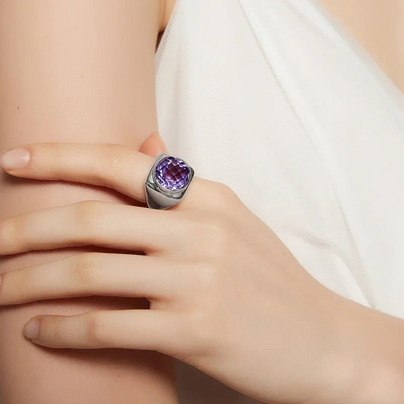 oval amethyst sculptural ring worn on the hand from a second angle
