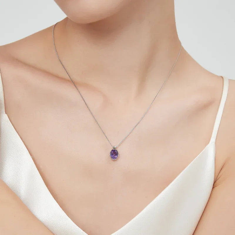 oval amethyst pendant necklace worn at the neckline in a portrait