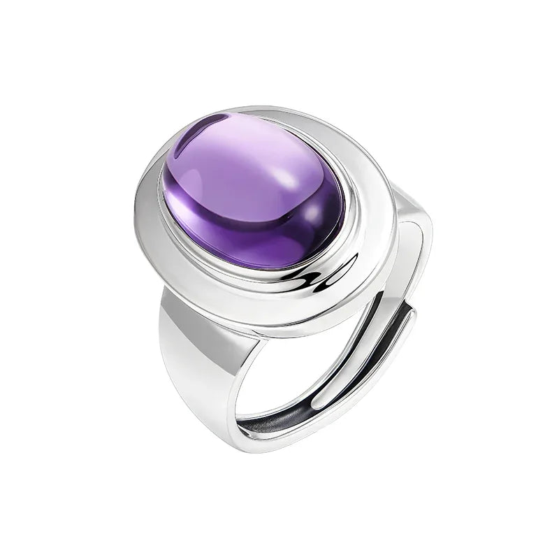 oval amethyst wide-band ring angled product view on a white background