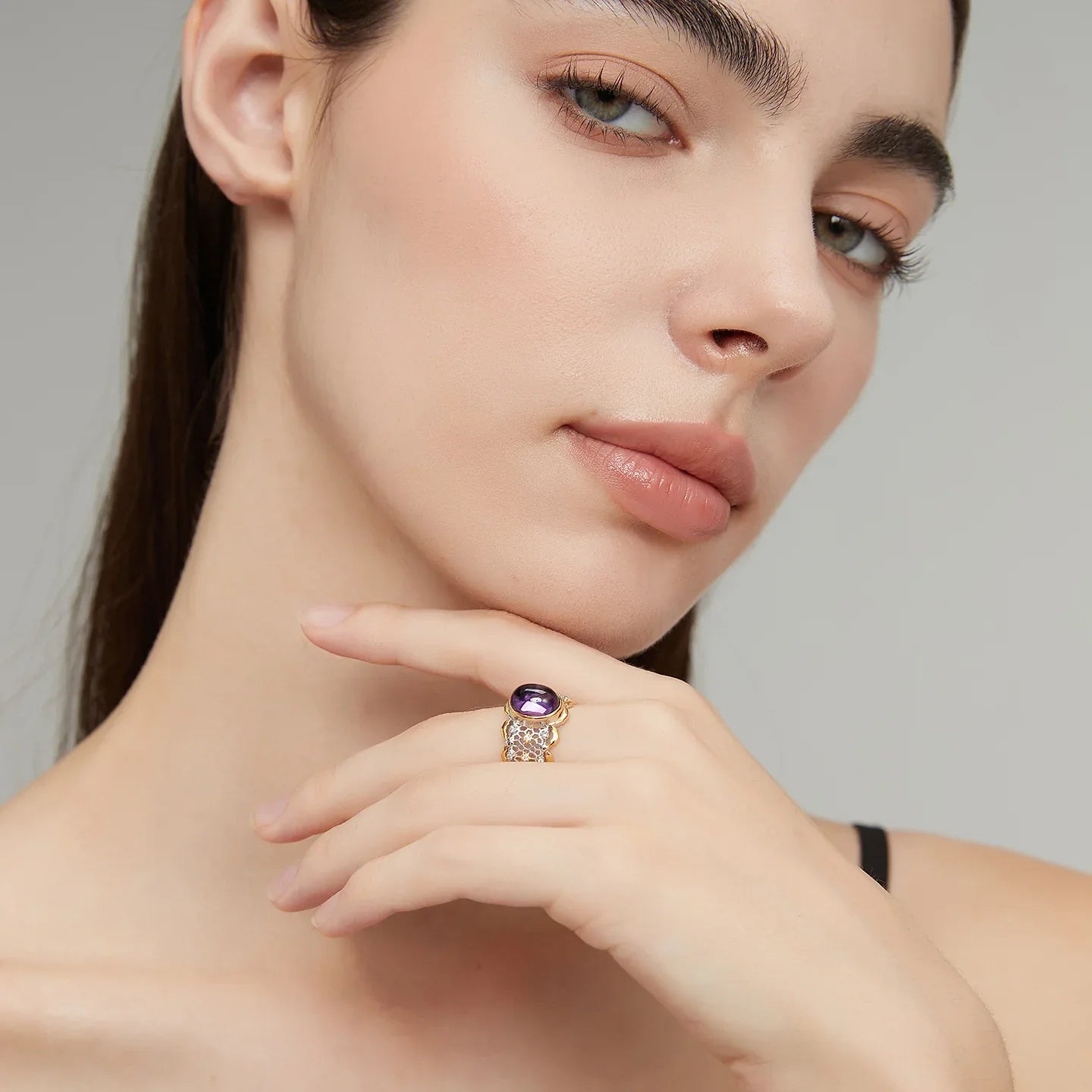 oval amethyst filigree ring styled portrait showing the ring for scale
