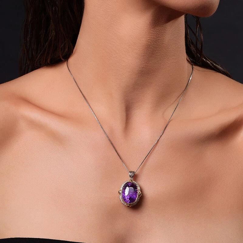 oval amethyst halo pendant necklace worn at the neckline in a portrait