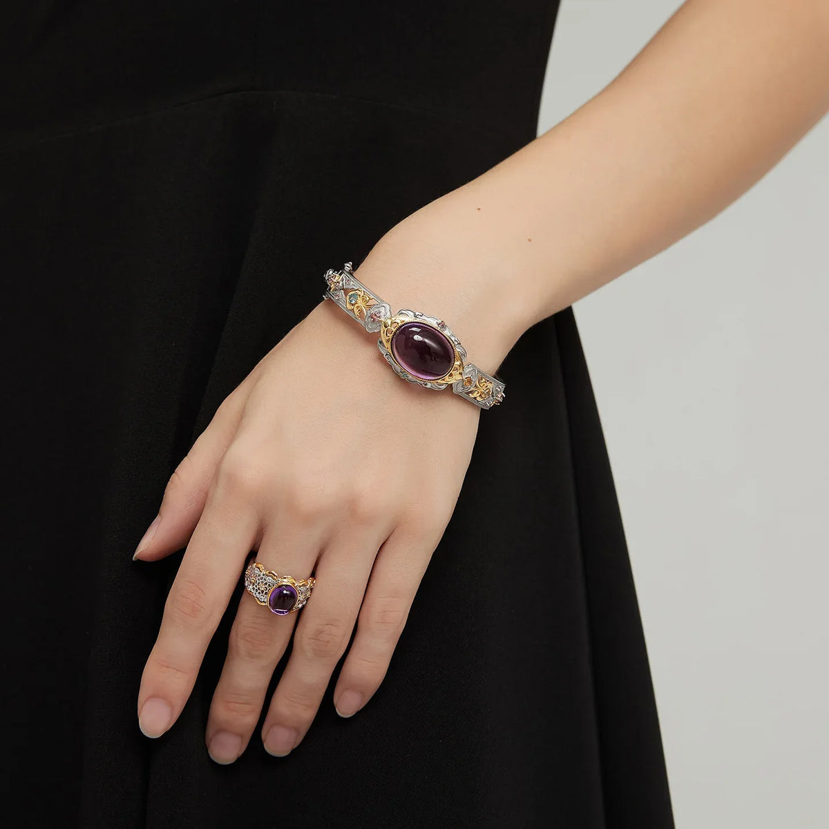 oval amethyst openwork bracelet worn on the wrist from a second angle