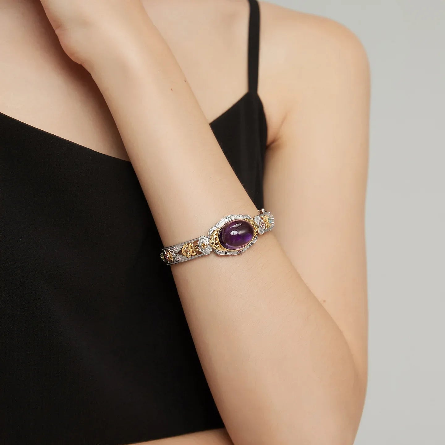 oval amethyst openwork bracelet worn on the wrist in a close-up