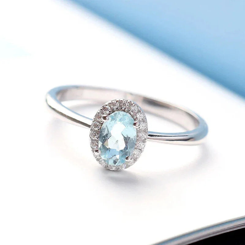 Oval Aquamarine Bezel-Set Ring styled hand view showing ring scale