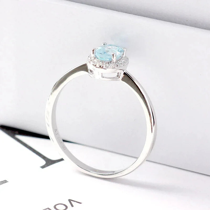 Oval Aquamarine Bezel-Set Ring worn on the hand from a second angle