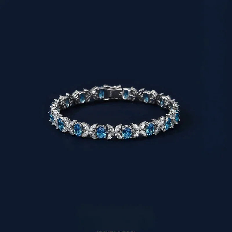 Oval Aquamarine Butterfly-Link Bracelet bracelet view on a dark background