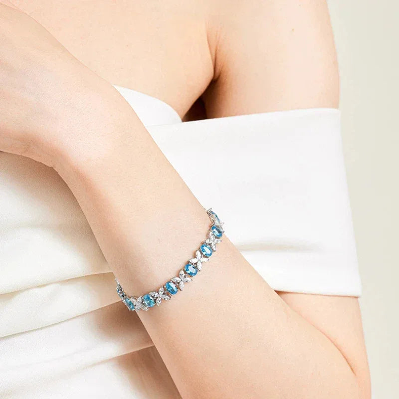 Oval Aquamarine Butterfly-Link Bracelet styled wrist view showing bracelet scale