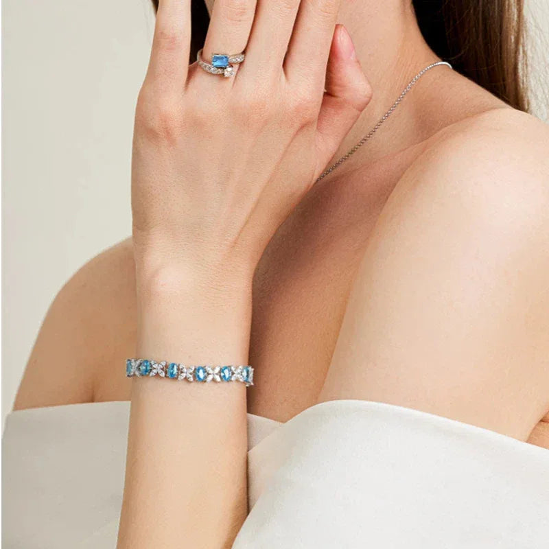 Oval Aquamarine Butterfly-Link Bracelet worn on the wrist from a second angle