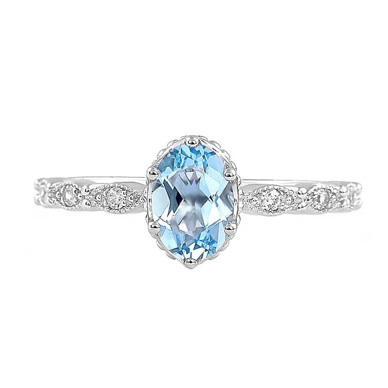 Oval Aquamarine Crown Accent Ring angled product view showing the setting