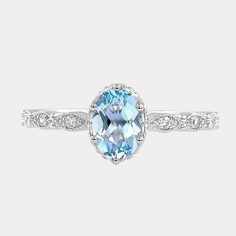 Oval Aquamarine Crown Accent Ring front product view on a white background