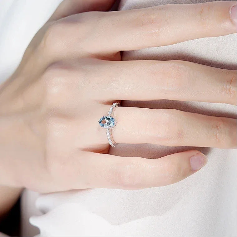 Oval Aquamarine Crown Accent Ring styled hand view showing ring scale