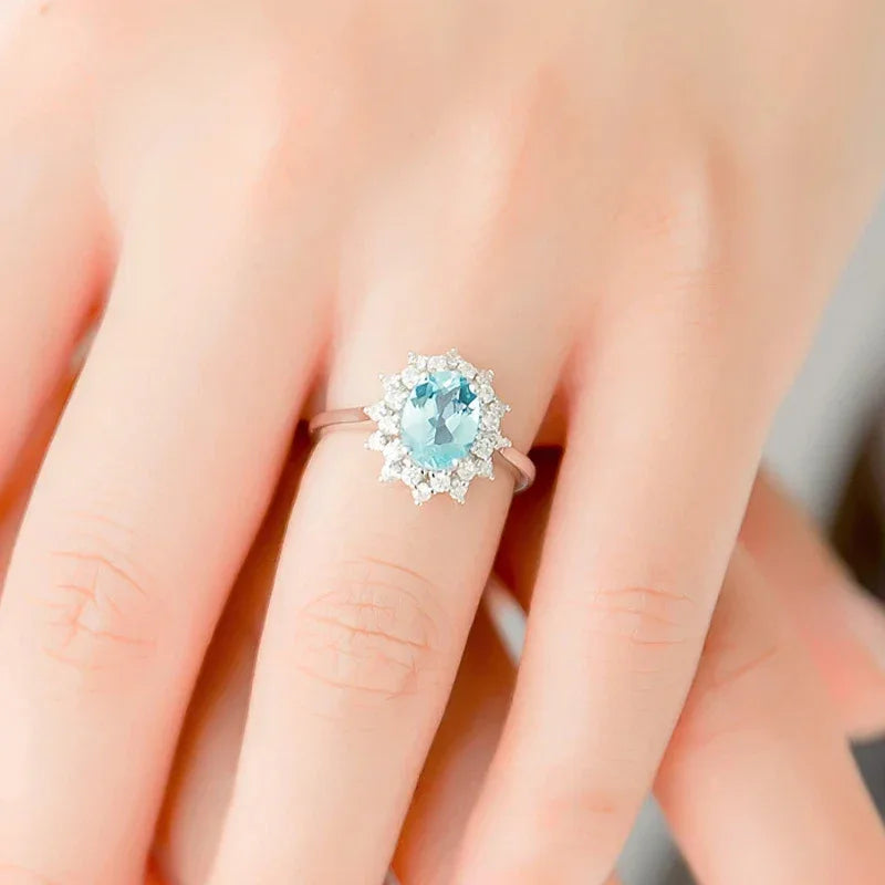 Oval Aquamarine Halo Ring worn on the hand from a second angle