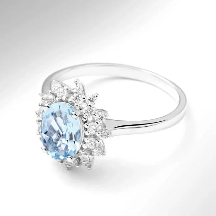 Oval Aquamarine Halo Ring worn on the hand in a close-up