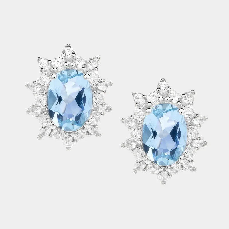 Oval Aquamarine Starburst Halo Stud Earrings paired product view on a white background