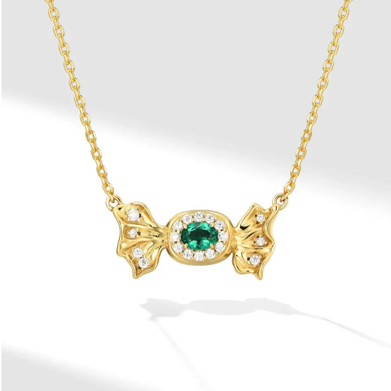 Oval Emerald Butterfly Necklace pendant view on a dark background