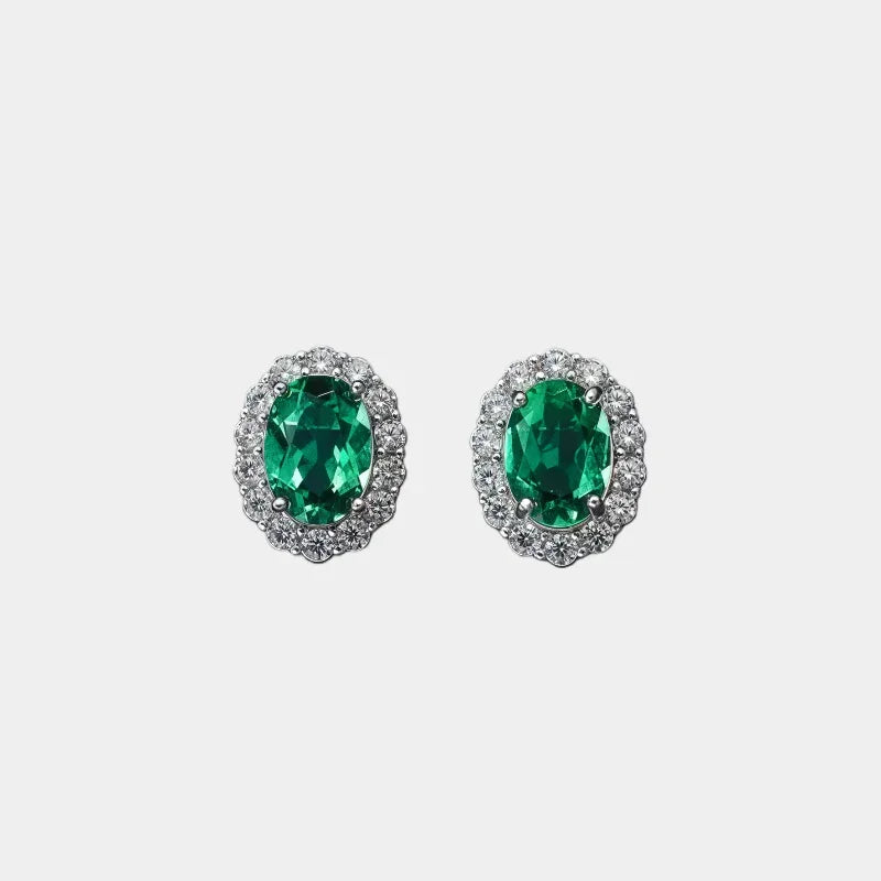 Oval Emerald Halo Stud Earrings paired product view on a white background