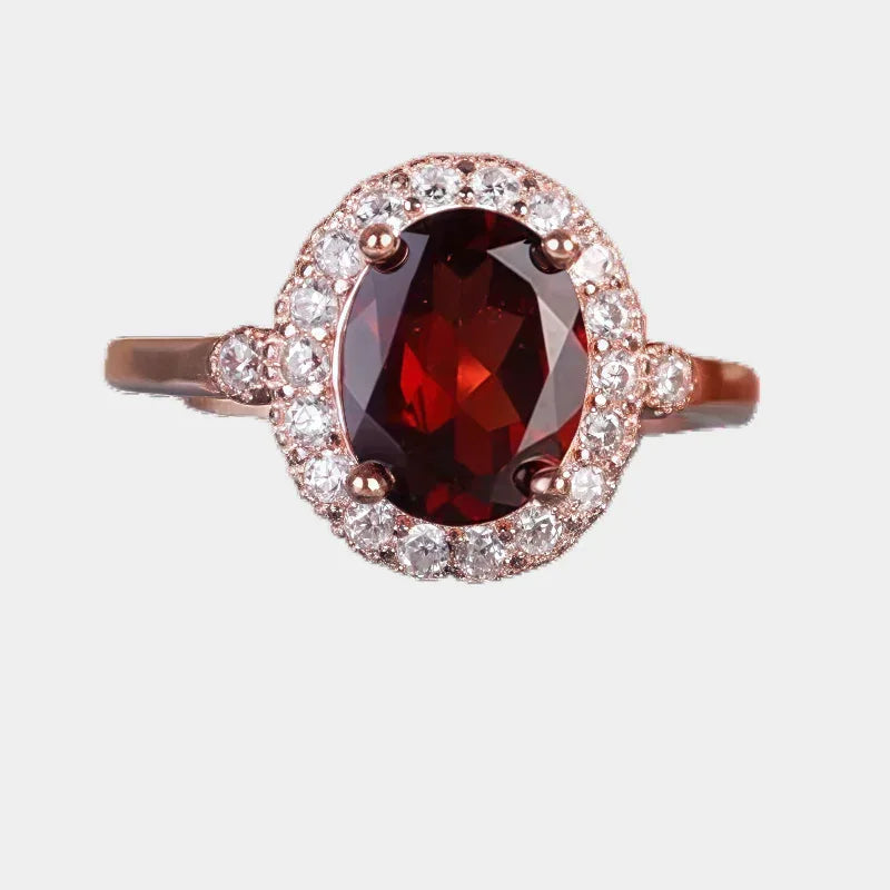 Oval Garnet Halo Adjustable Ring front product view on a light background