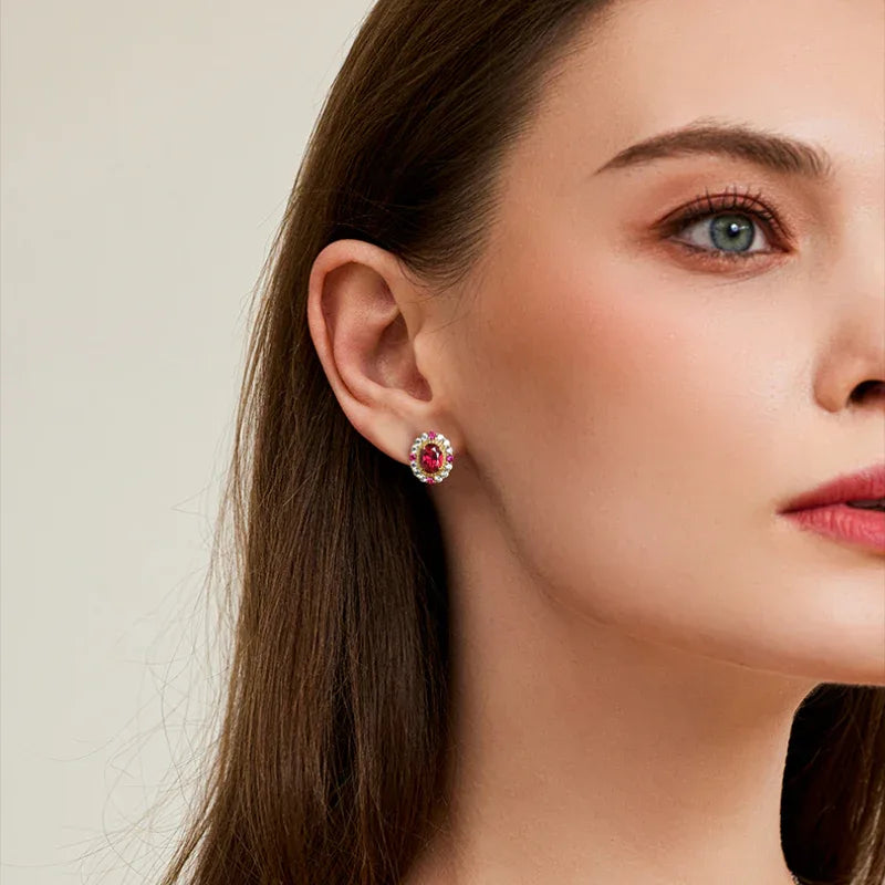 Oval Ruby Gold-Tone Stud Earrings — earrings worn on ear