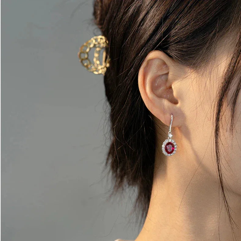 Oval Ruby Halo Drop Earrings — earrings worn on ear