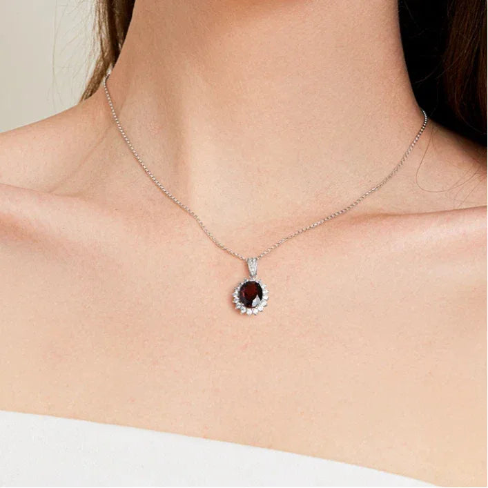Oval Ruby Starburst Pendant Necklace with Dark Center — necklace worn at neckline