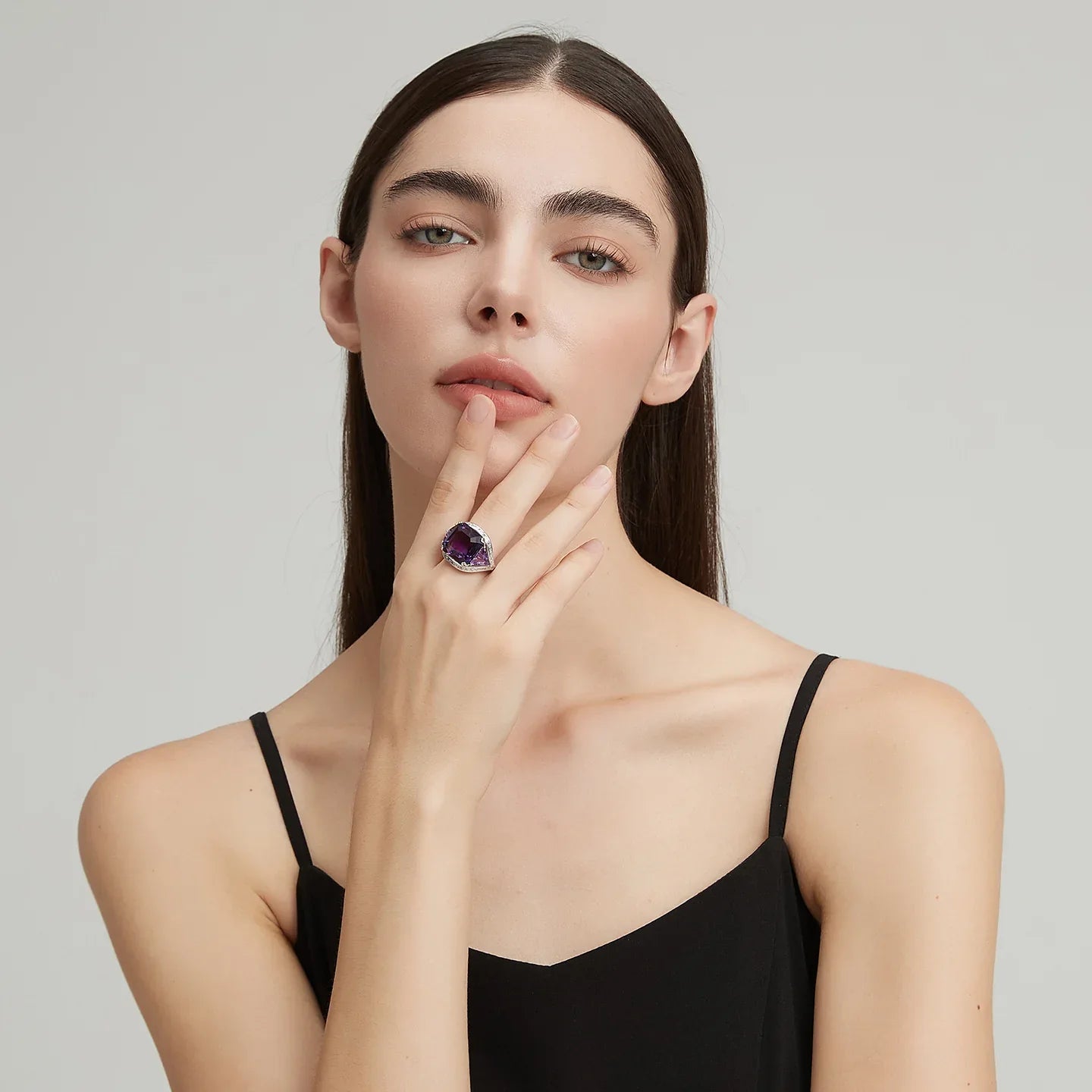 oversized amethyst open ring worn on the hand from a second angle