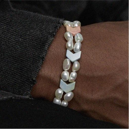 Pastel Baroque Pearl Double-Strand Bracelet — wrist-worn close-up under a dark sleeve