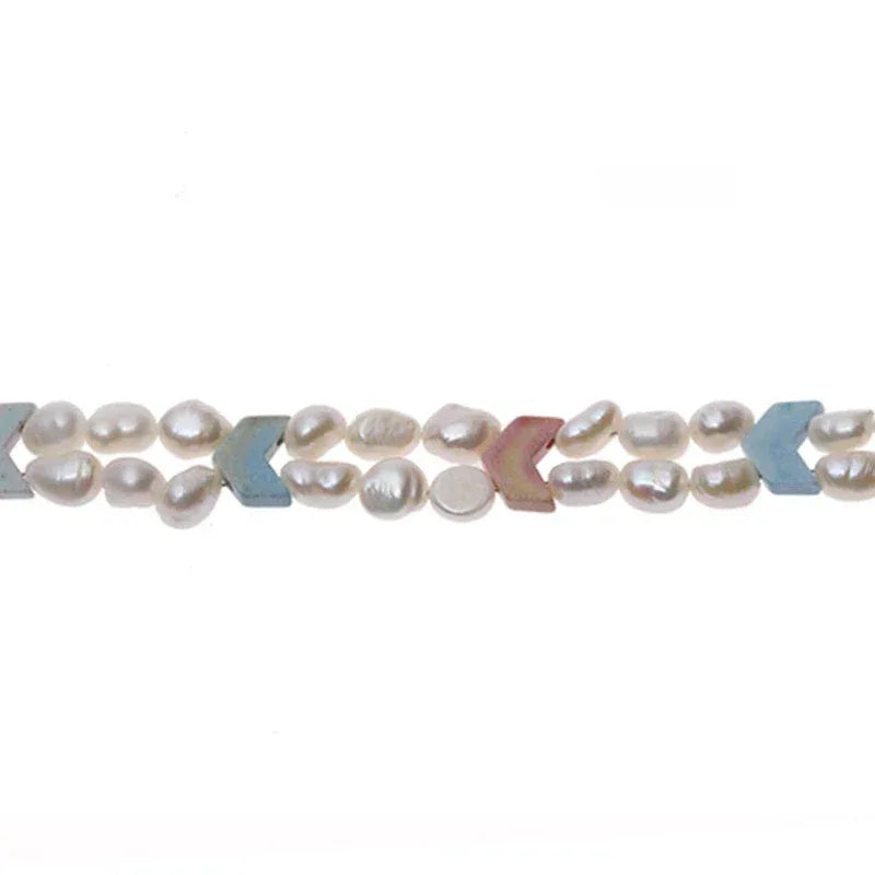 Pastel Baroque Pearl Double-Strand Necklace — macro view of pale pearls and pastel geometric accents