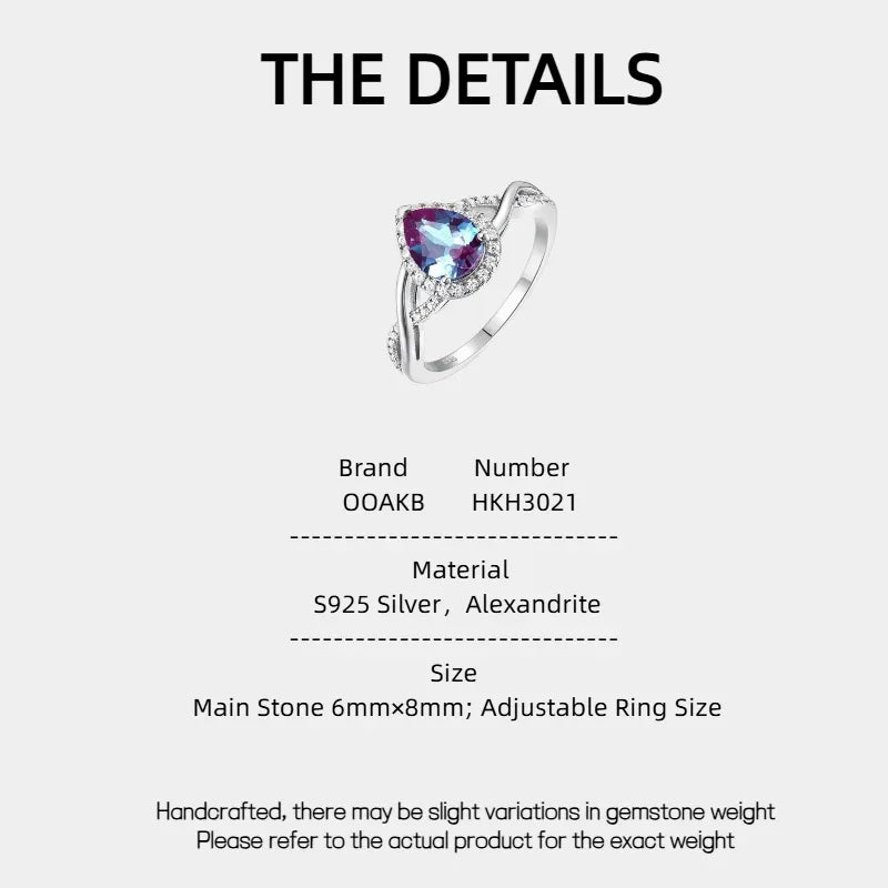 Pear-cut Alexandrite halo ring with a sweeping bypass band, product specification card with text