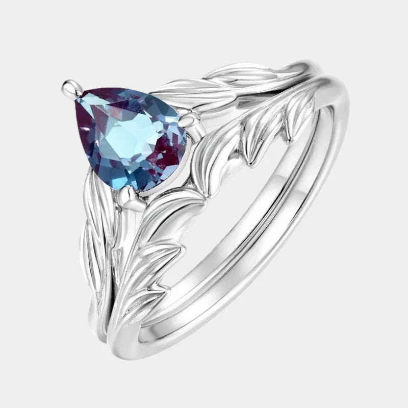 Pear-cut Alexandrite leaf stack ring, front product view on a white background